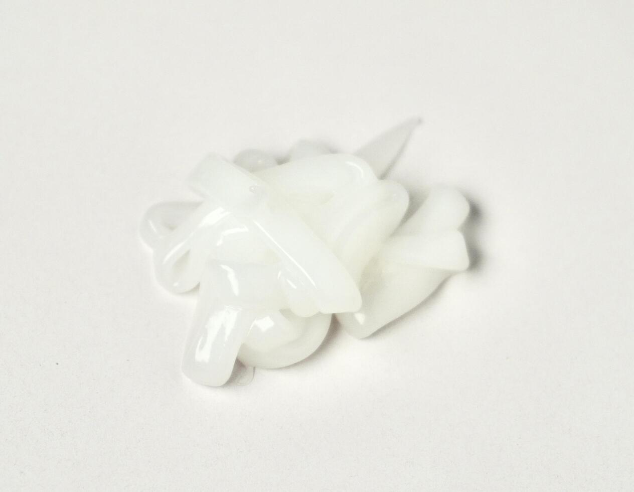 Conditioner or liquid soap drop texture when freshly squeezed from bottle shape isolated on horizontal white background. photo