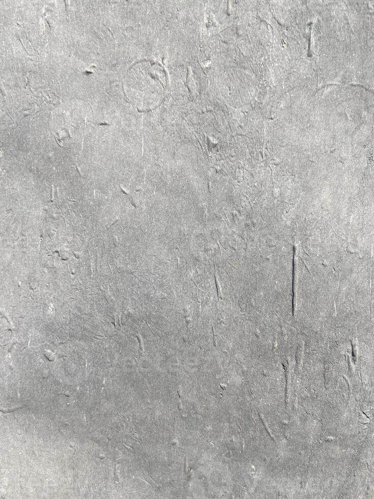 A close up of a gray concrete wall photo