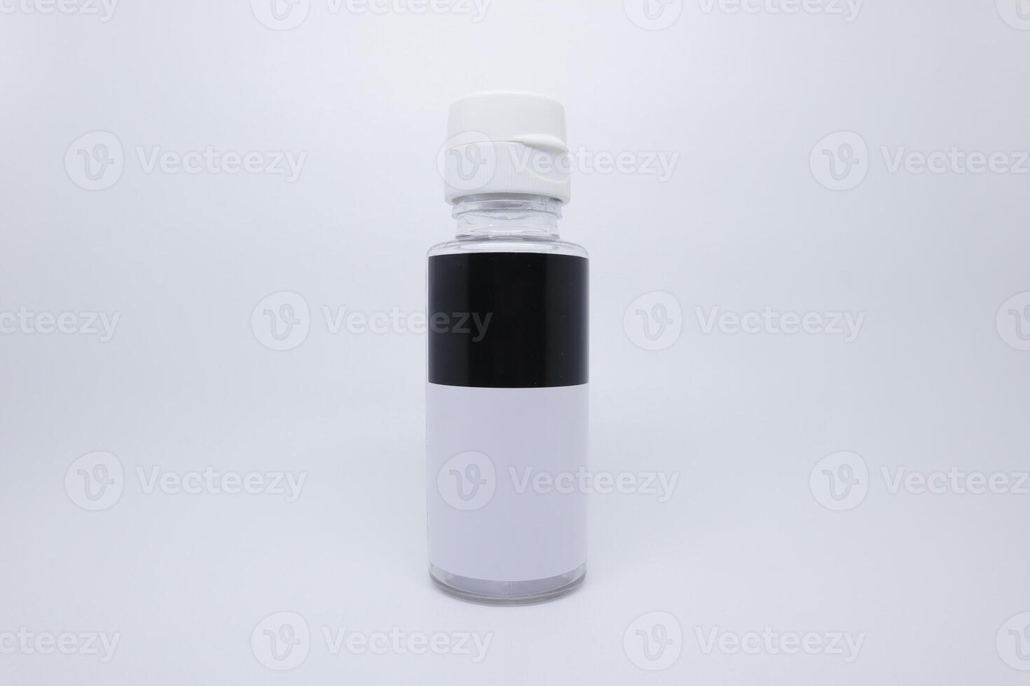 A white and black bottle with a white cap photo