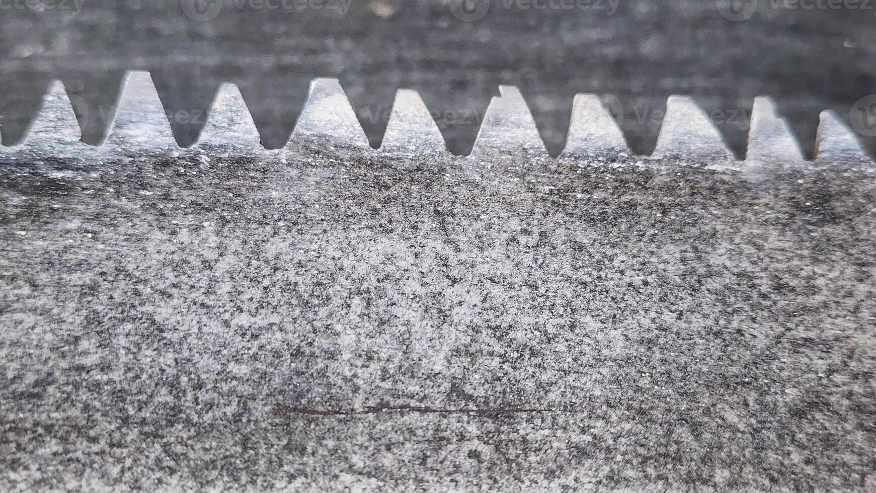 a close up of a metal saw blade photo