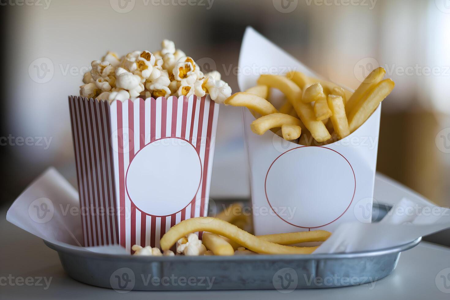Two containers, popcorn and curly fries, sit surrounded by a cozy atmosphere photo