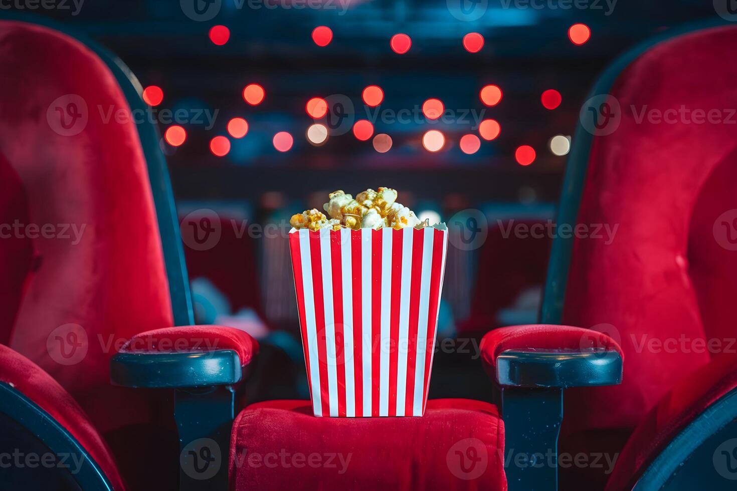 Cinema with plush seats, popcorn creating intimate, cozy movie watching atmosphere photo