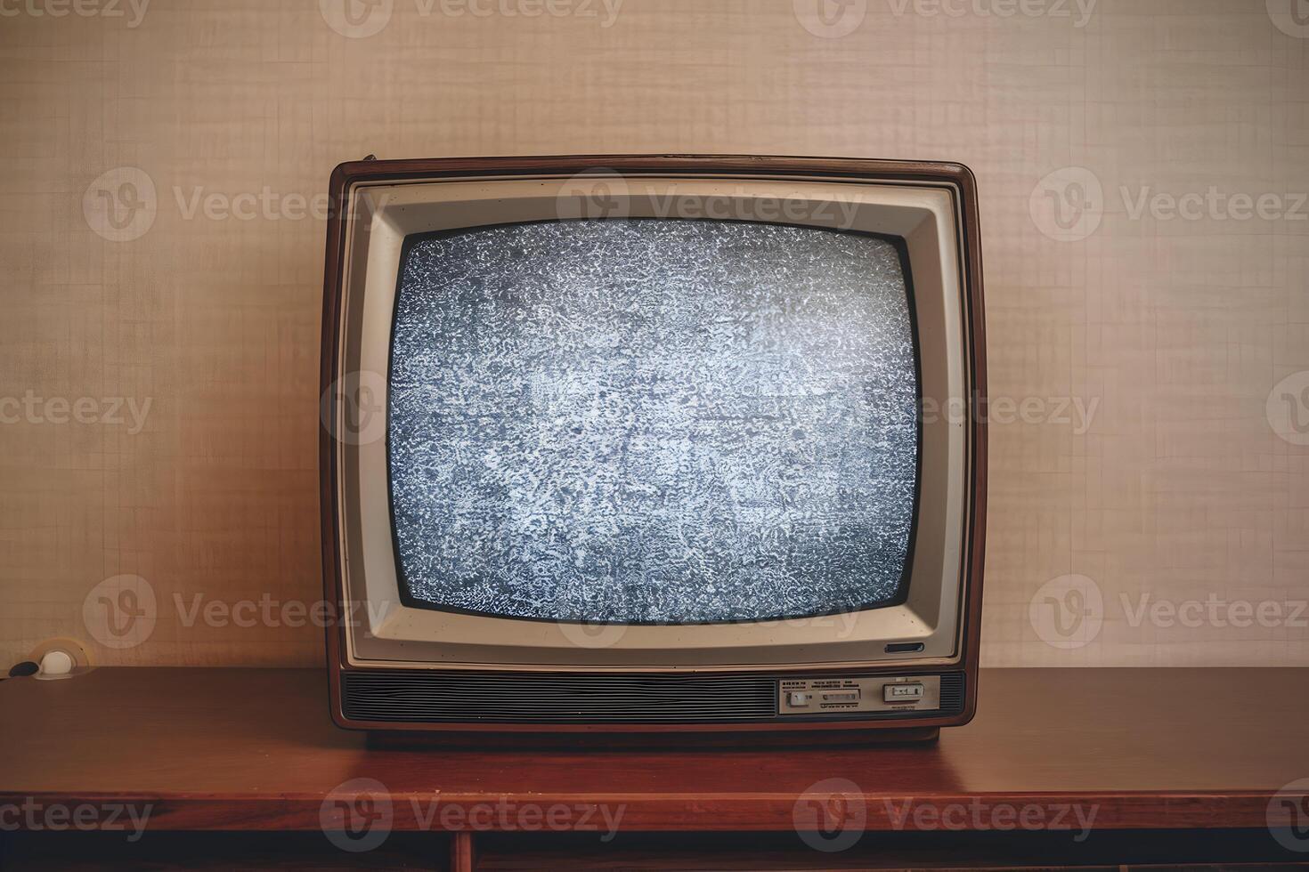Retro CRT television on wooden surface displays static, evoking nostalgic simplicity photo