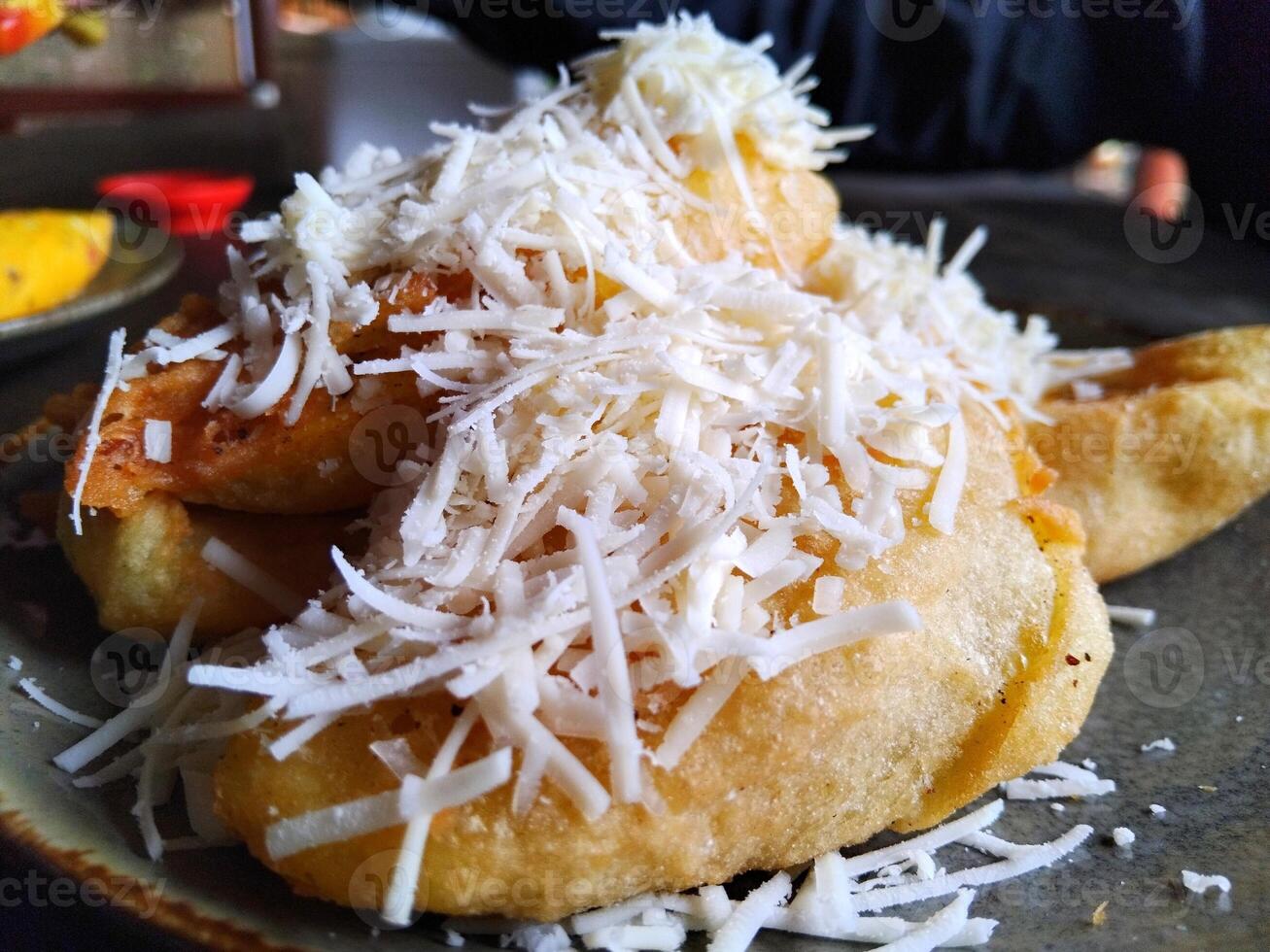 Fried bananas with cheese topping photo