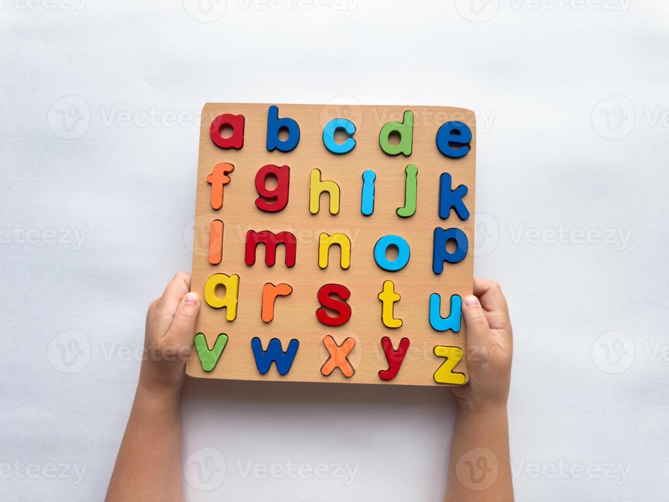 Colorful alphabet puzzle board for early childhood learning and development photo