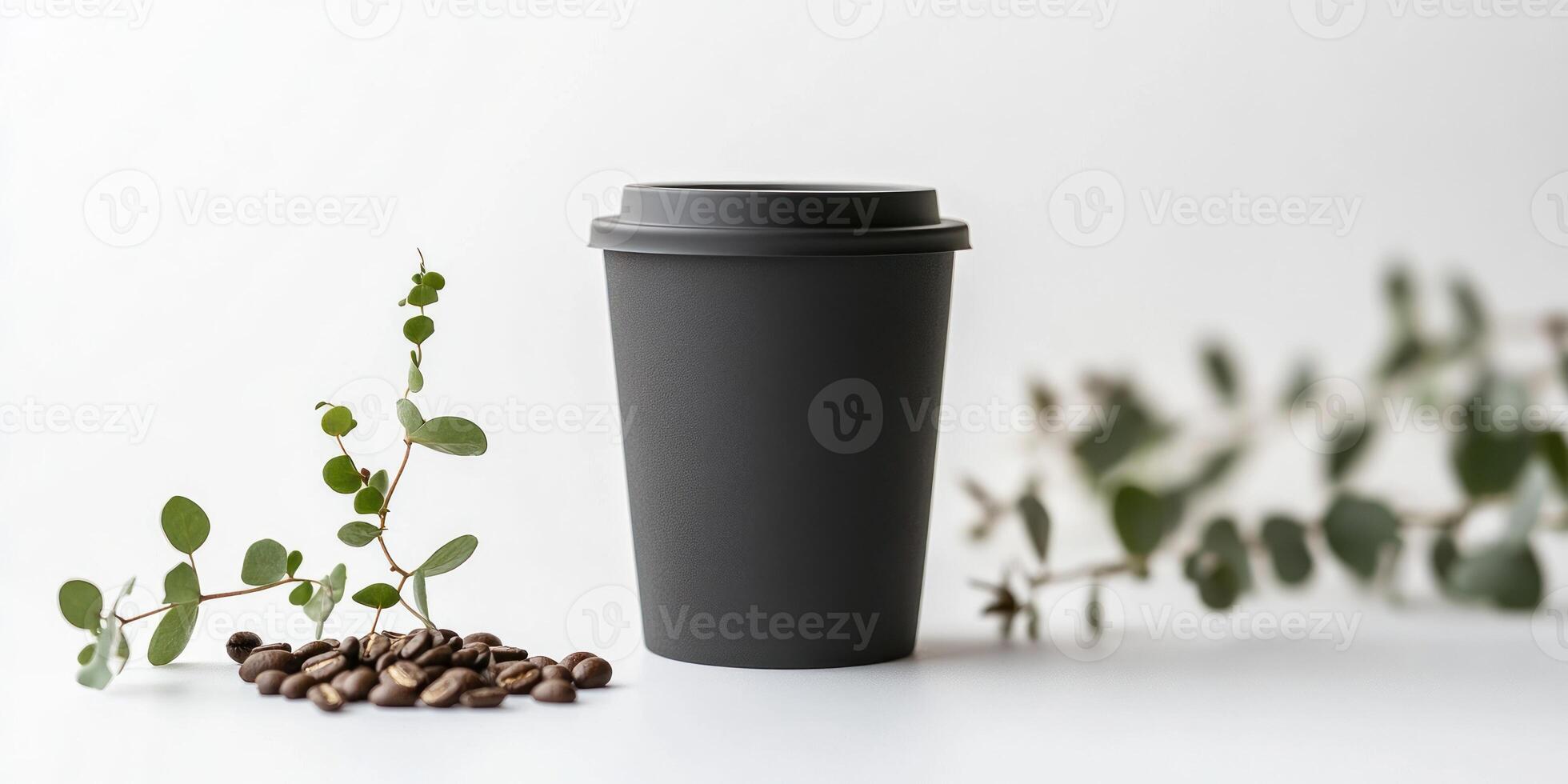 Minimalist black coffee cup with eucalyptus leaf and coffee beans on white background photo