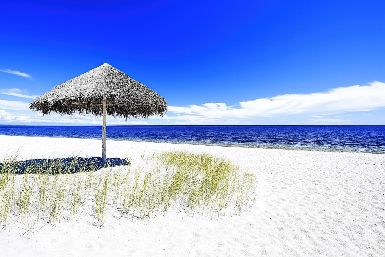 Tranquil Beach Scene with Straw Umbrella photo