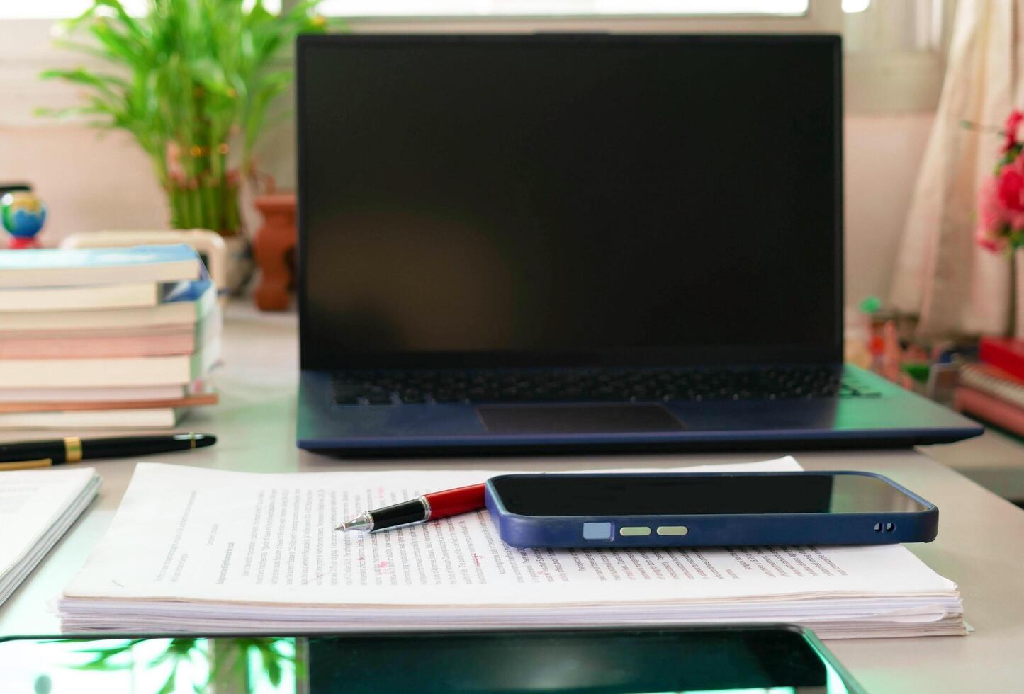 proofreading paper and office supplies on table photo