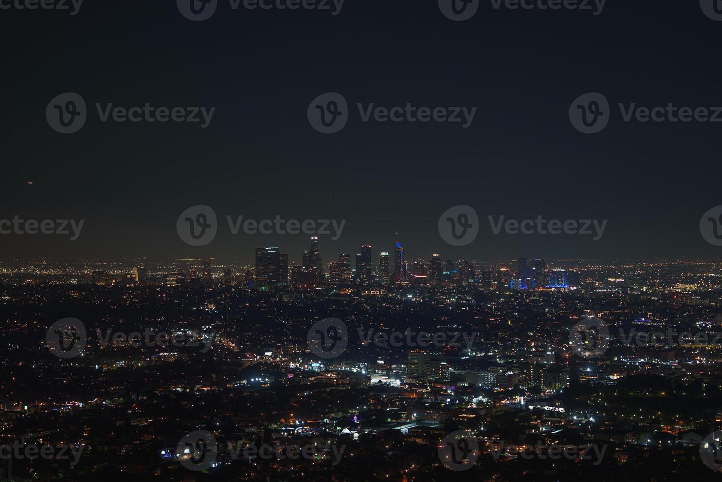 Nighttime View of Los Angeles Skyline with Illuminated Skyscrapers photo