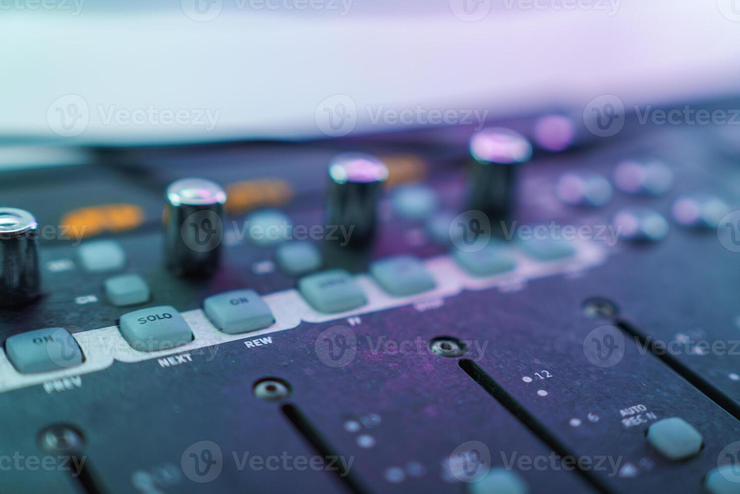 Close Up of Audio Mixing Console with Colorful Illumination photo