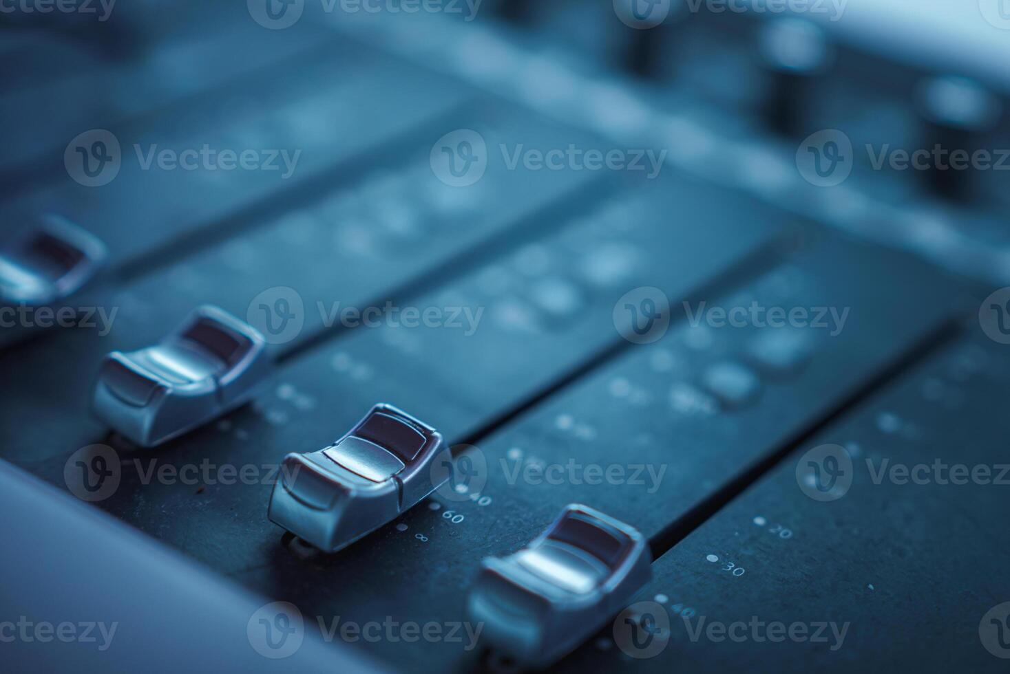 Close Up of Professional Audio Mixing Console with Faders photo