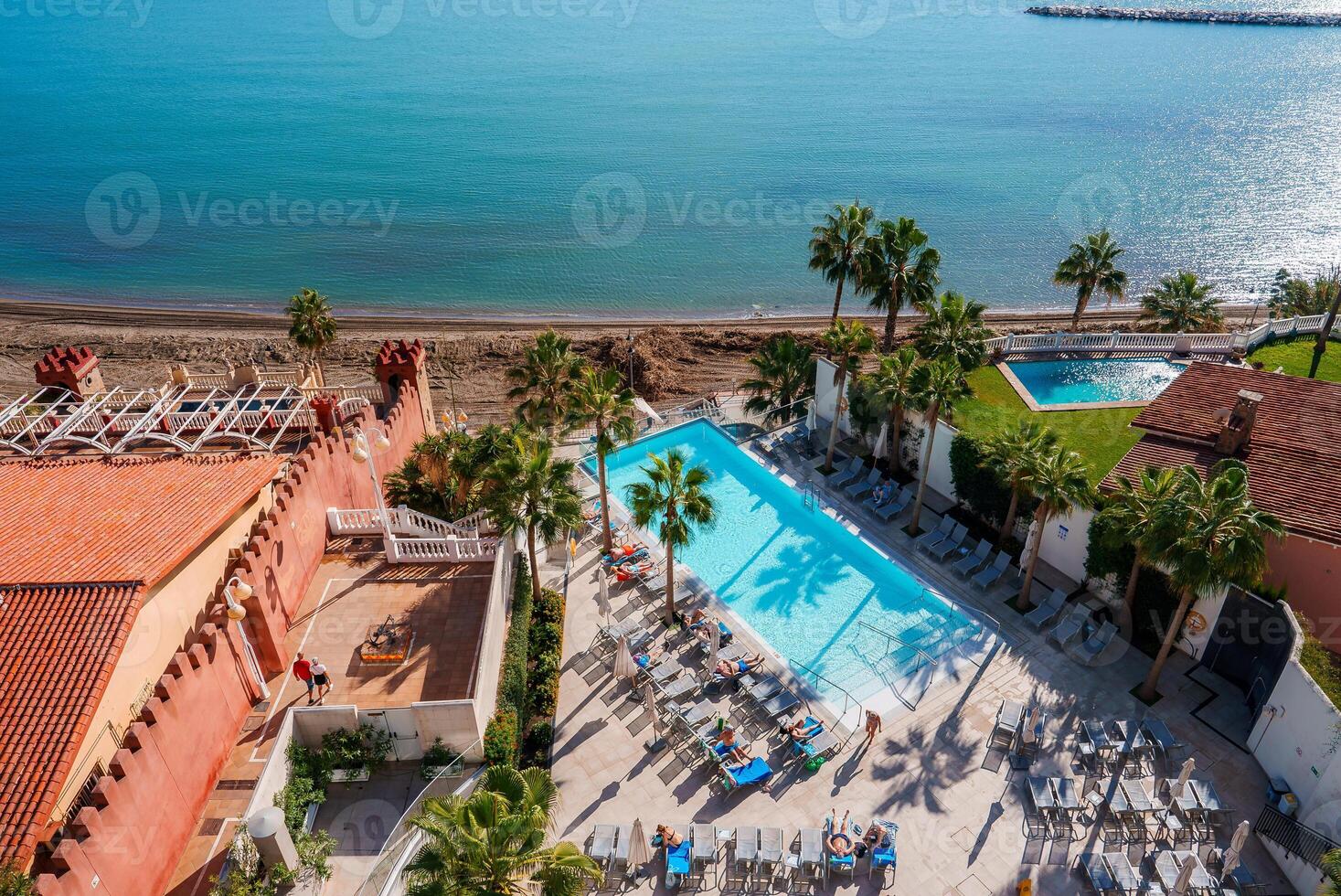 Resort Pool and Beach View in Benalmadena, Spain with Unique Architecture photo