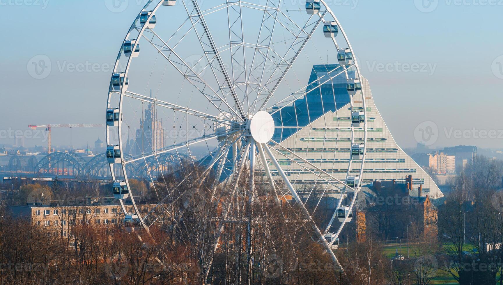 Aerial View of Ferris Wheel and National Library in Riga's Victory Park photo
