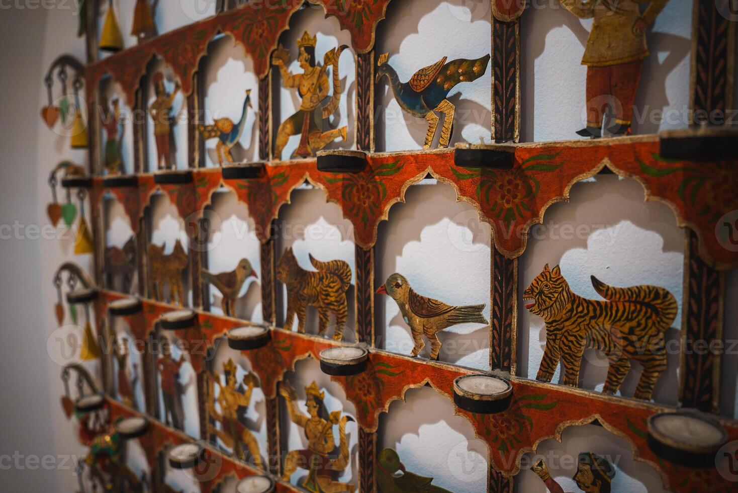 Intricate Wall Display with Arched Niches and Hand Painted Figures photo