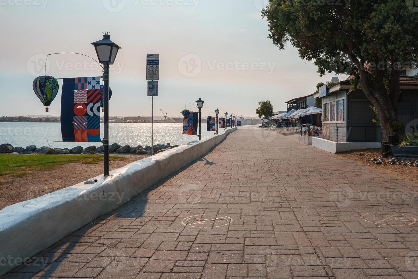 Waterfront Promenade with Shops and Banners in Coastal California photo