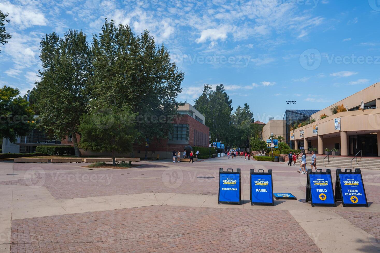 UCLA Campus Event with Directional Signs and Modern Architecture photo