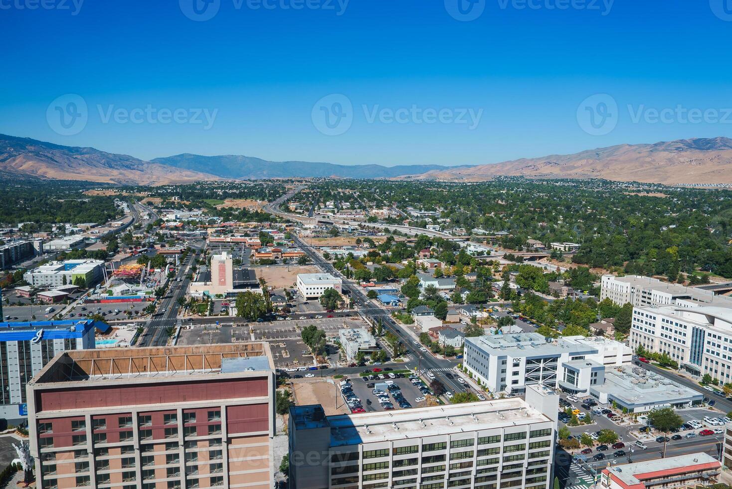Panoramic View of Reno's Urban Landscape and Surrounding Mountains photo