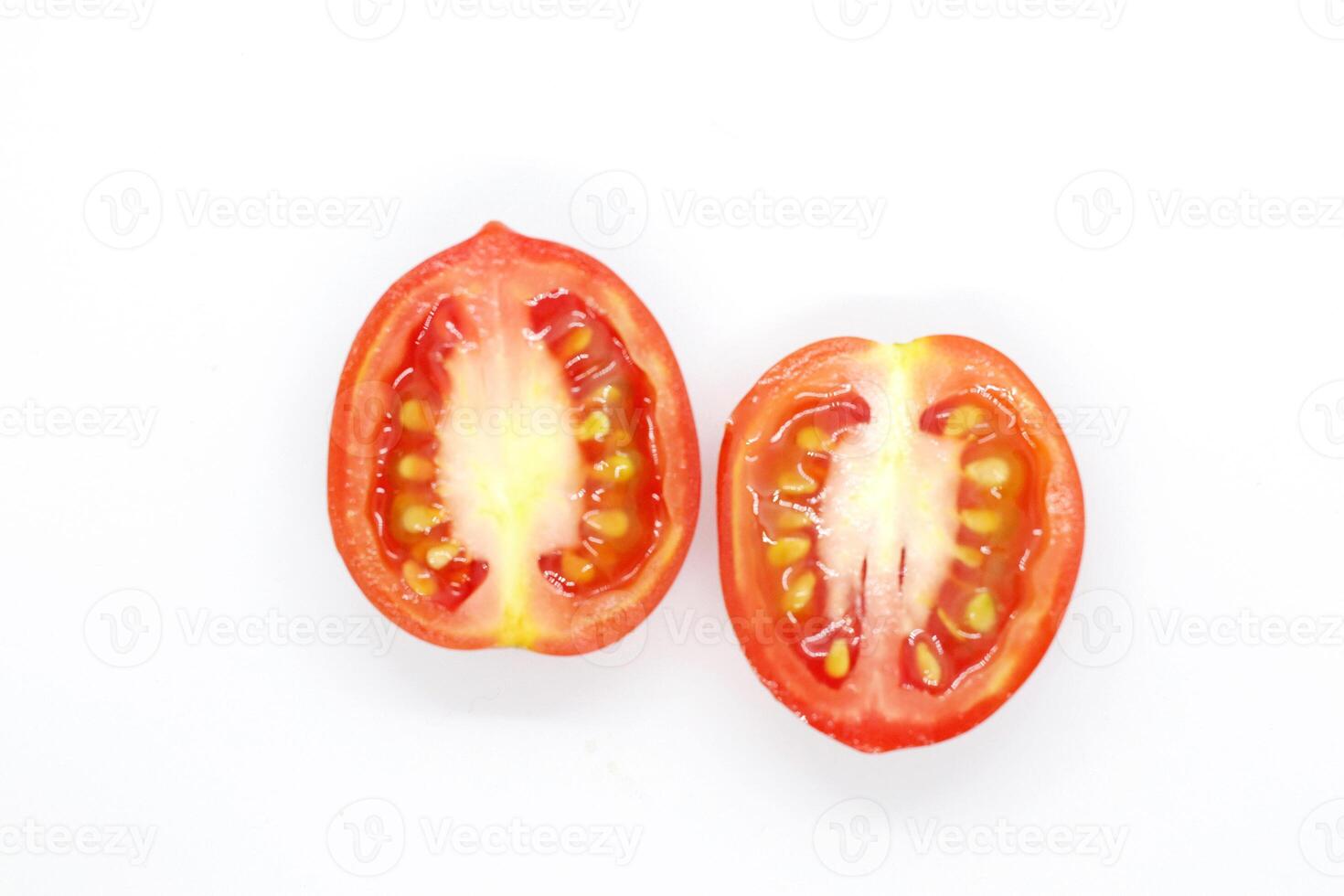 Tomato slice top view isolate. Tomato on white background. Set of round tomato slices. With clipping path. photo