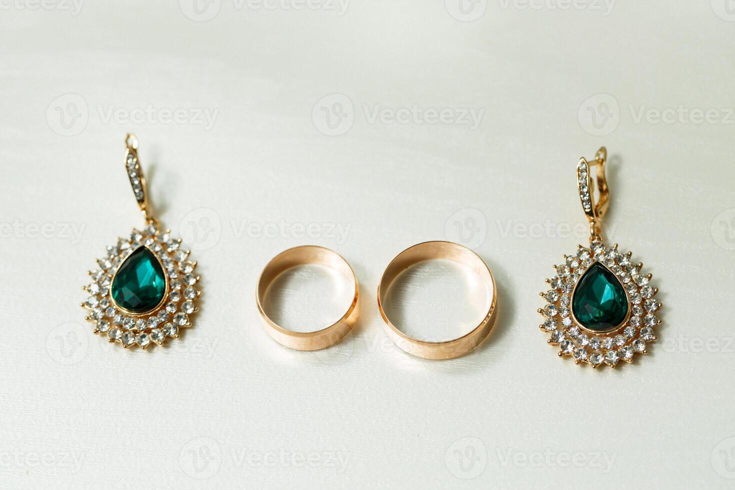 Golden wedding rings for newlyweds on their wedding day photo