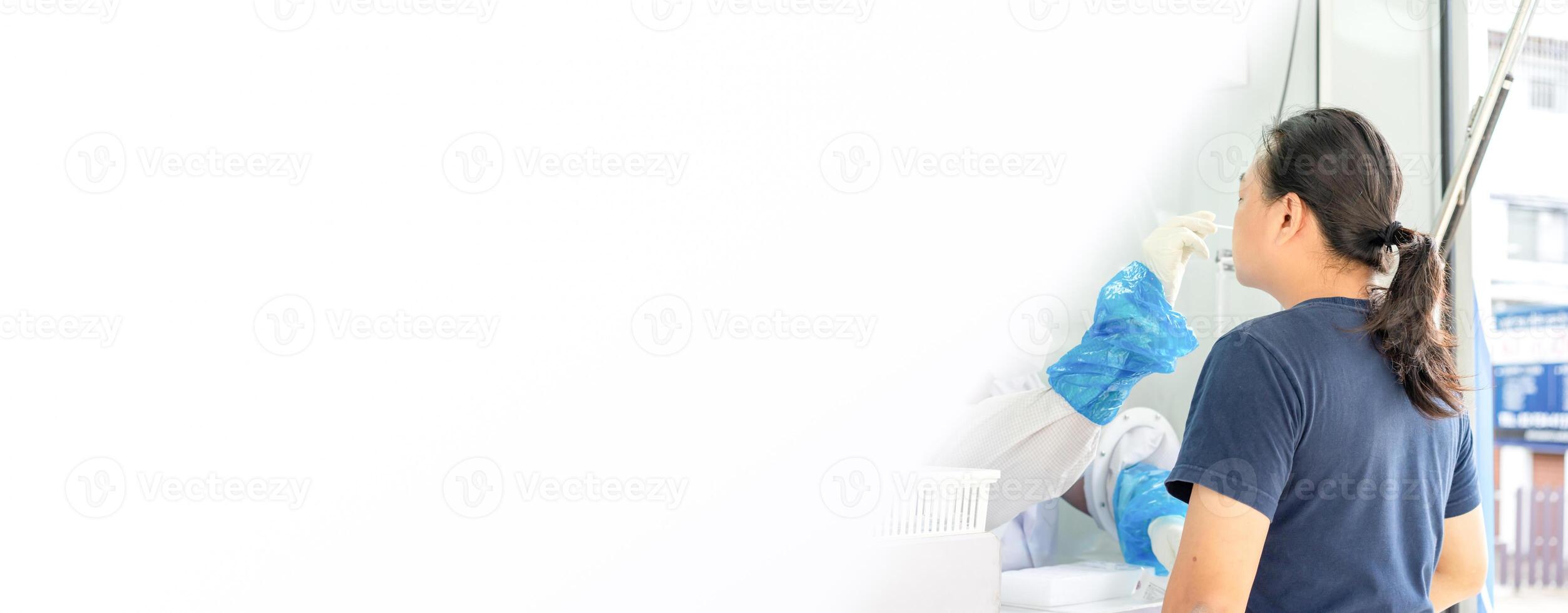 Asian man was tested by medical staff in negative room pressure for covid-19 test at outdoor field. photo