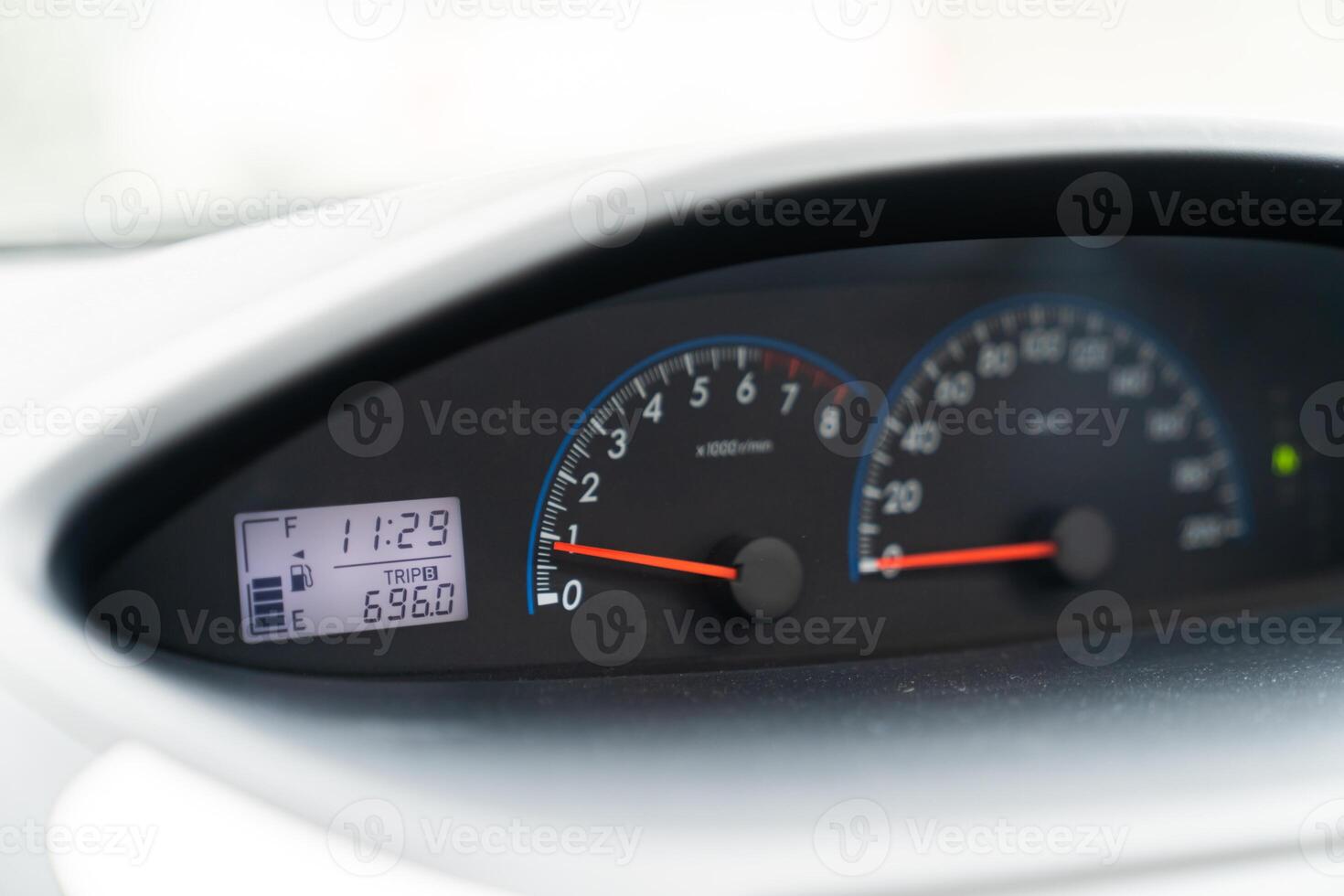 gasoline gauge dash board in car with digital warning sign. photo