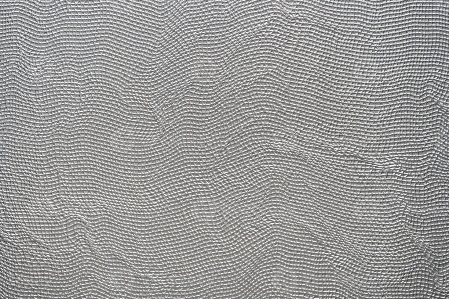 The aluminum silver stripe had a seamless background of a random line pattern, giving it a dynamic and eye-catching appearance. The silver color added to the sleek and modern look. photo