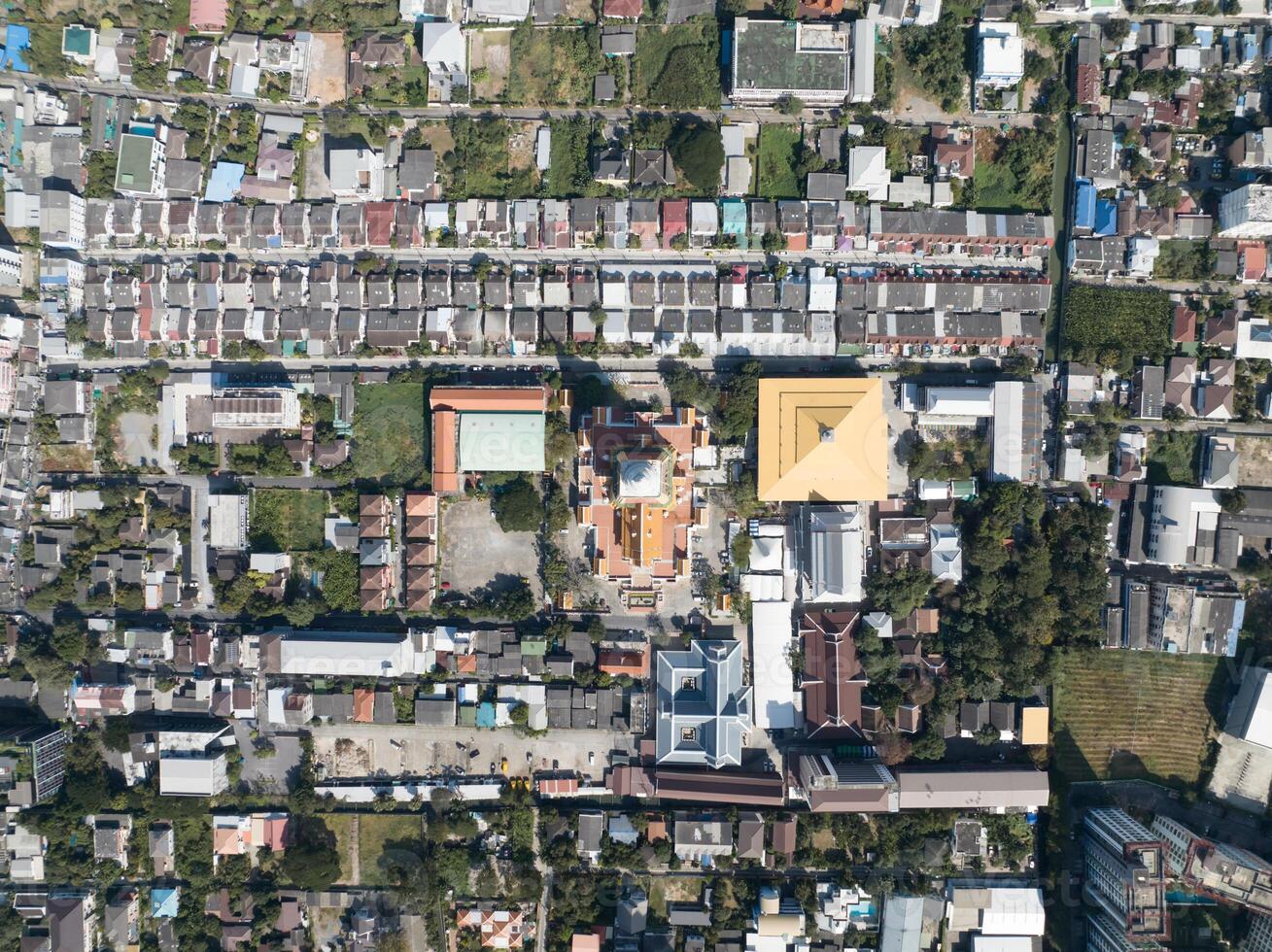 Drone Shot of Thailand temple names Wat Dhammamongkol, Located in Phra Khanong, Bangkok, Thailand. Thai Language Text letter in Photo mean 1. LONG LIVE THE KING, 2. DHUMMA LAND 3. PAGODA NAME