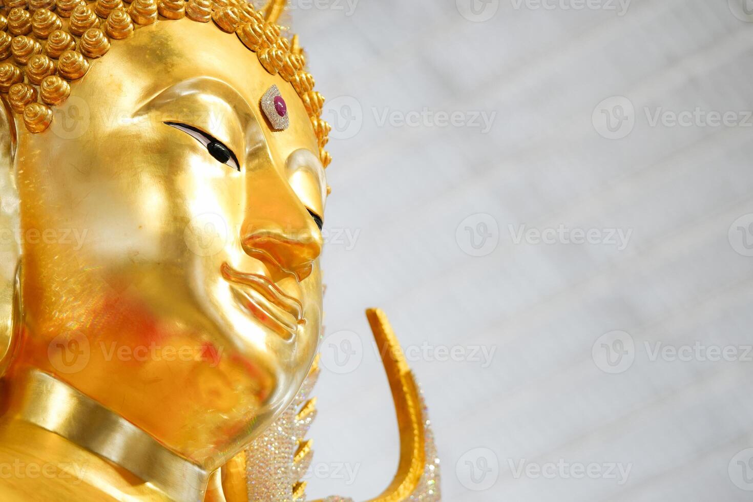 A stunning golden Buddha sculpture, exemplifying the deep reverence and devotion of Thai individuals in their spiritual worship. photo