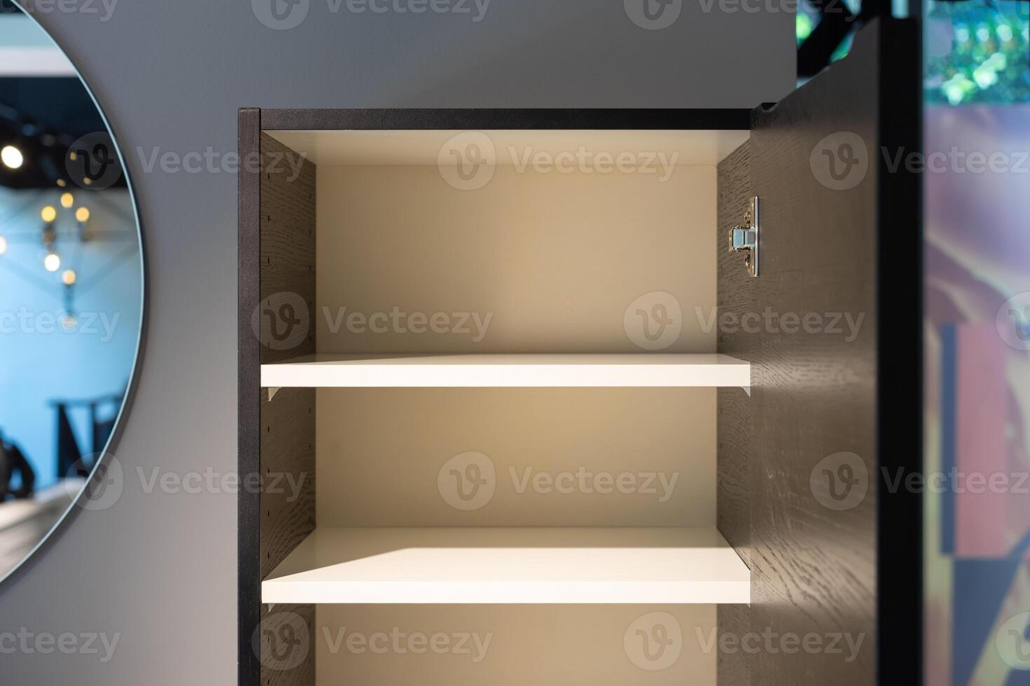 a empty black and white cabinet wood in modern and minimal style in front of wall in the restroom. photo