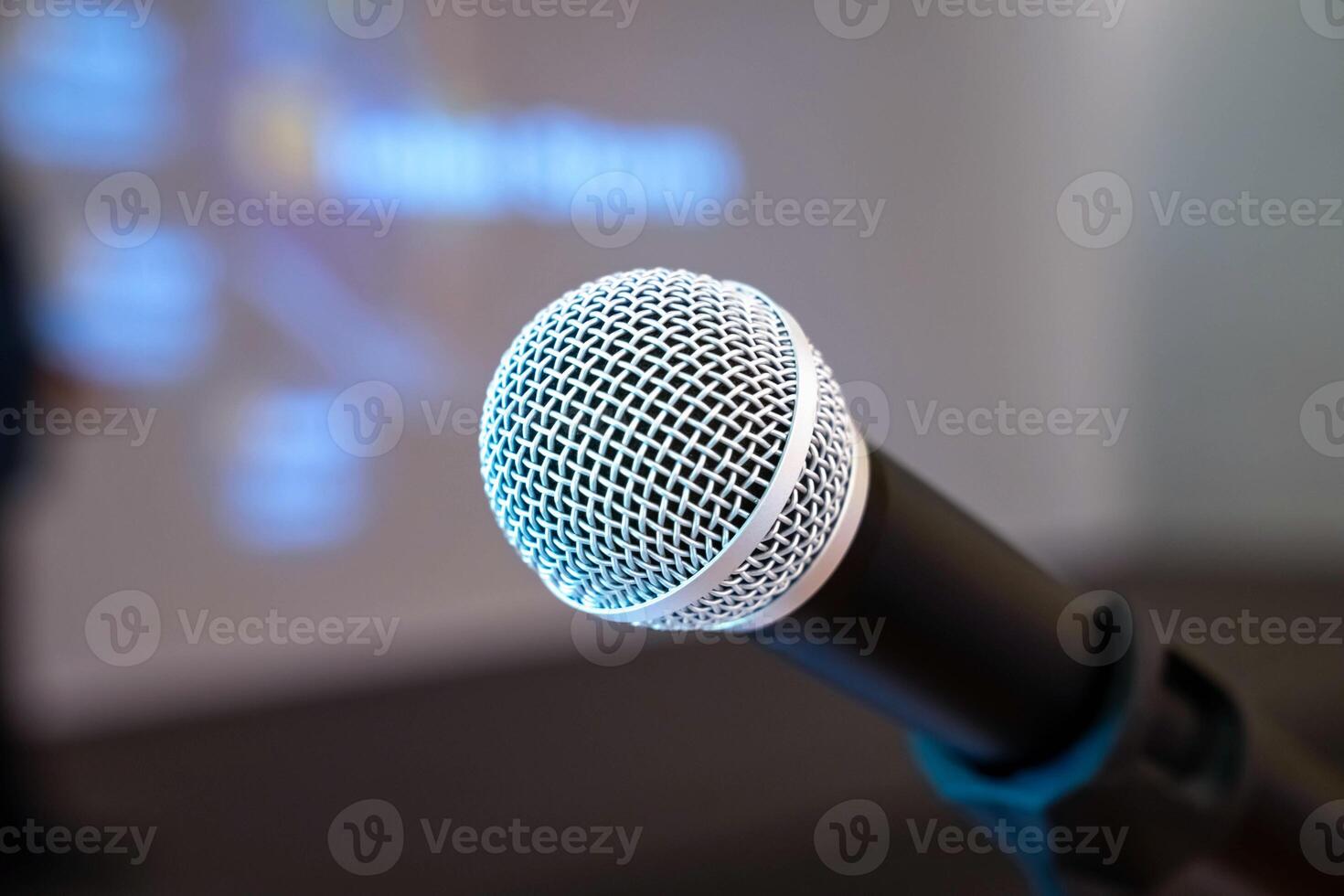 microphone is on microphone stand in seminar meeting room for everyone to use when speaking or greeting seminar participants. photo