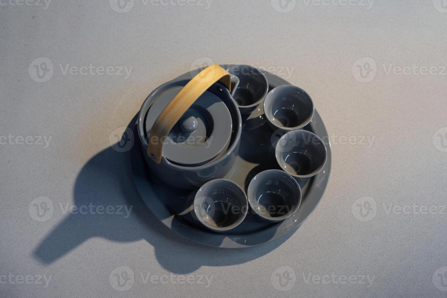 TeaPot ceramic set with New contemporary Modern and Vintage combination style on flat stone kitchen counter with sunlight from window. photo
