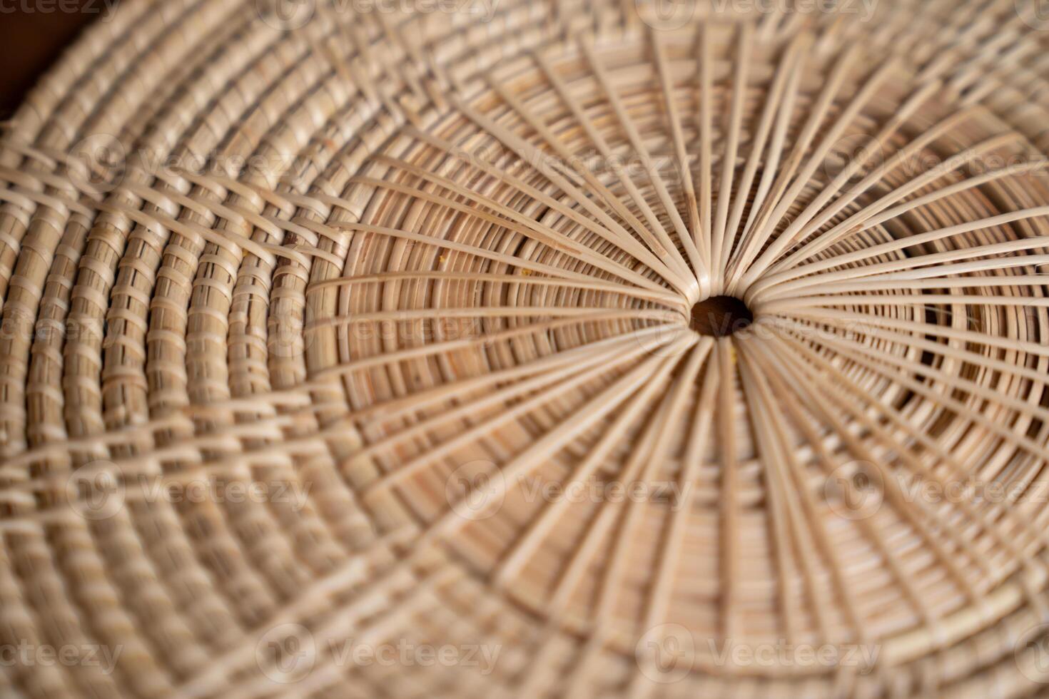 Close up to Round Circle woven straw mat Wicker pattern of local Thai handmade craft. photo