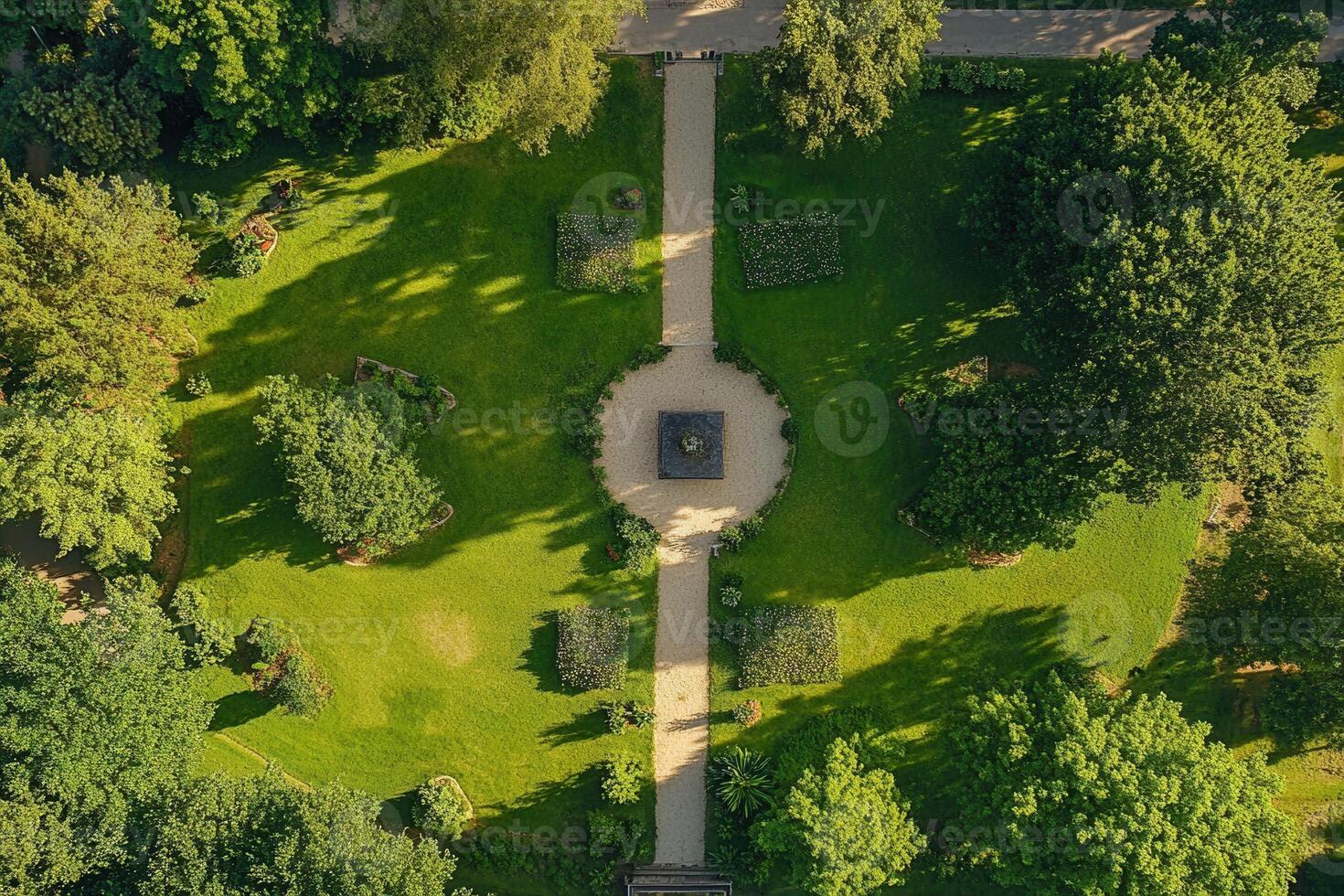 Aerial view of a symmetrical park with pathways and lush greenery. photo