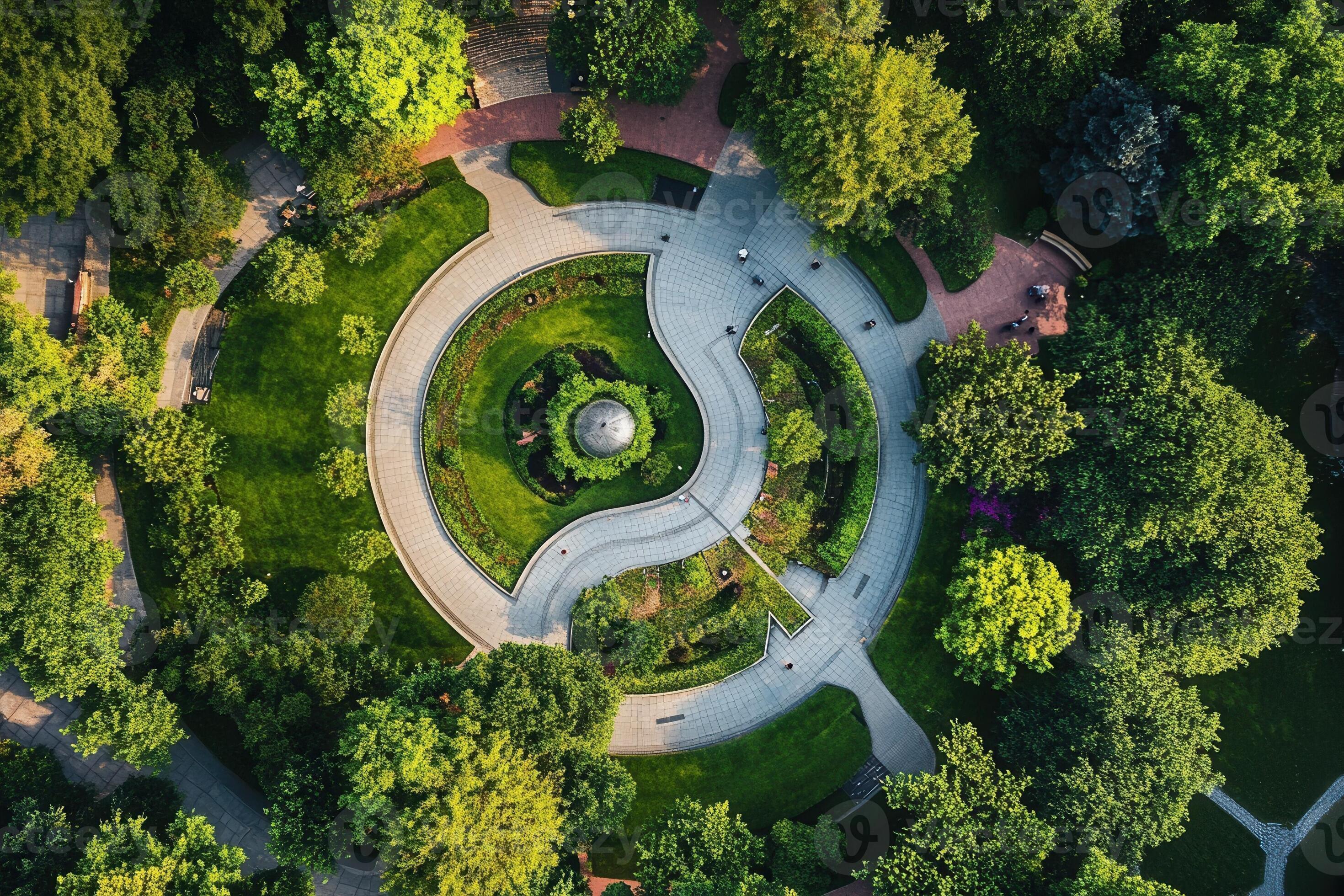 Aerial view of a circular park with lush greenery and winding pathways.  53423882 Stock Photo at Vecteezy