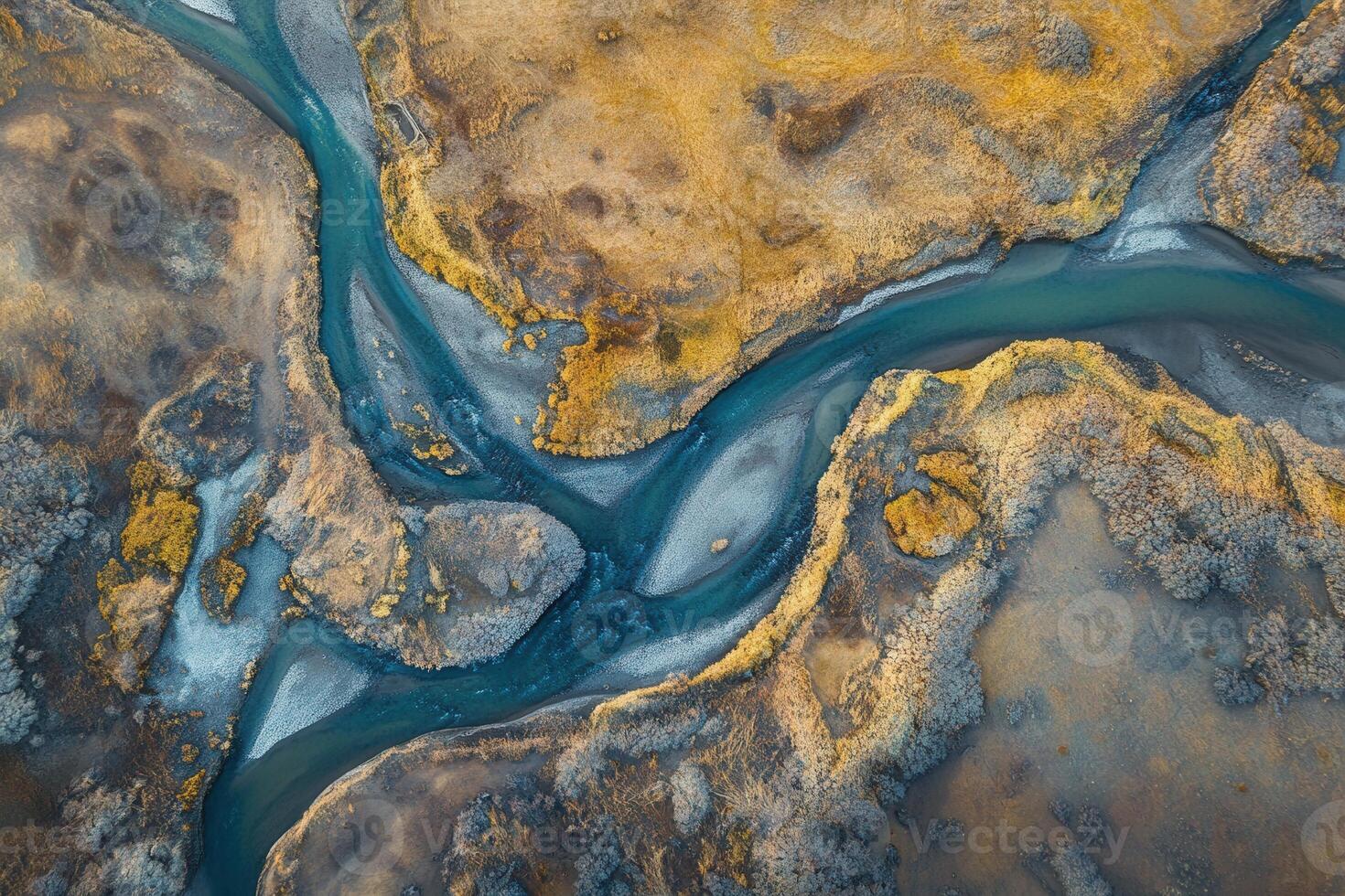Aerial view of a river meandering through a desolate landscape. photo