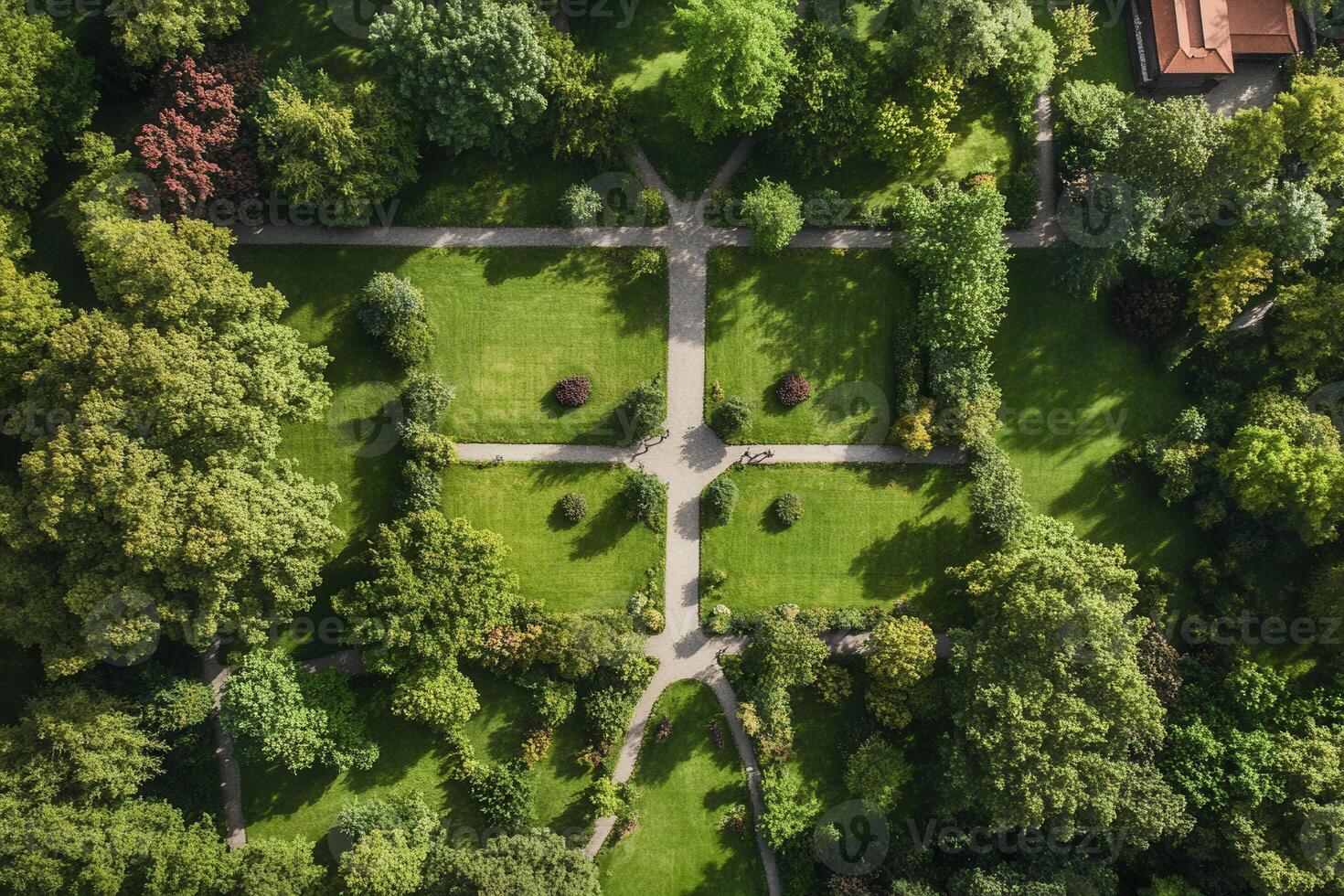 Aerial view of a lush green park with symmetrical pathways. photo