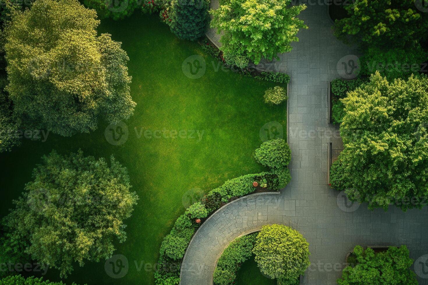 Aerial view of a lush green park with winding paths. photo