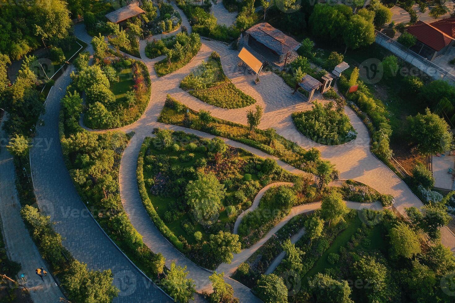 Aerial view of a scenic garden with winding paths, lush greenery, and tranquil atmosphere. photo