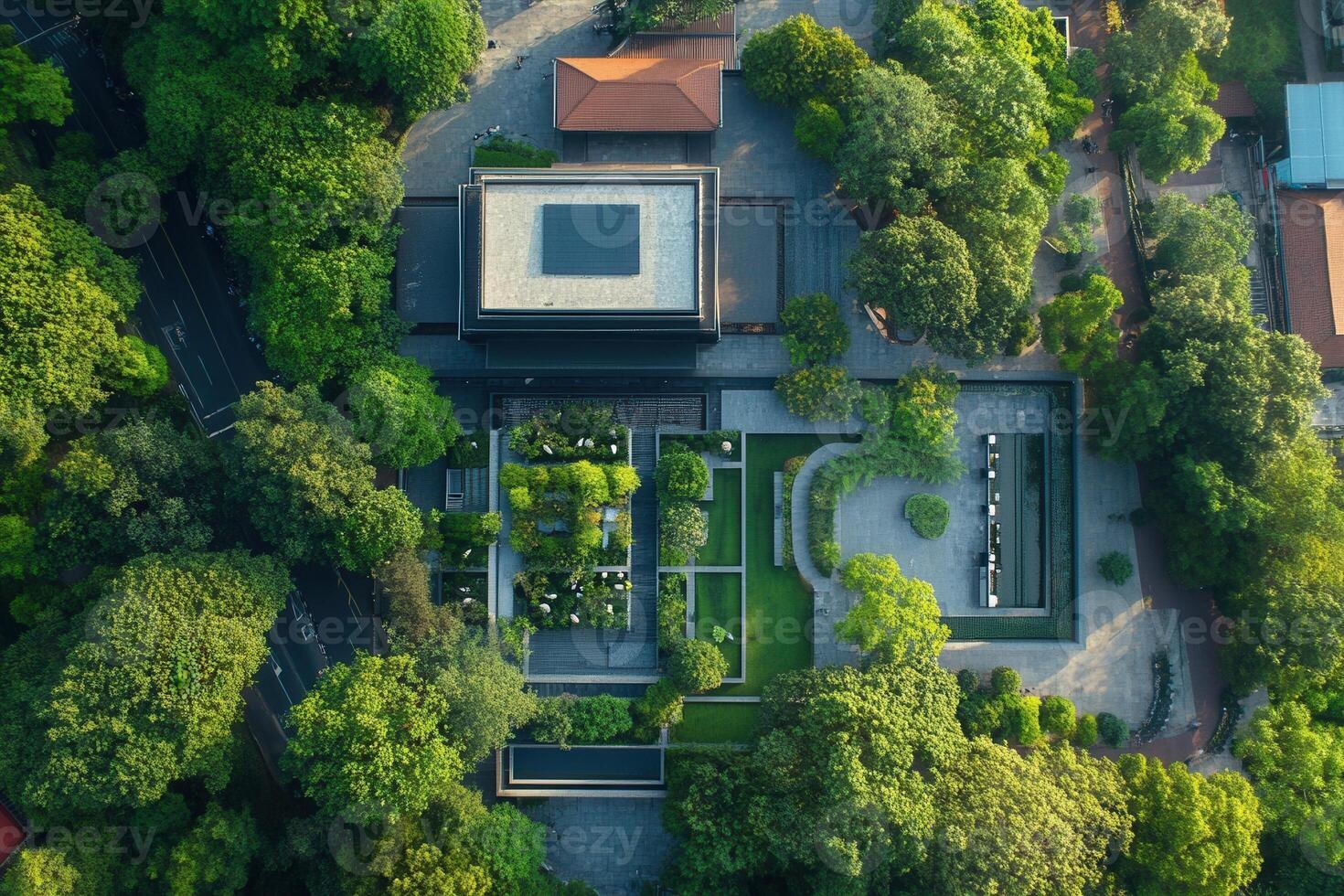 Aerial view of modern building nestled in lush green park. photo
