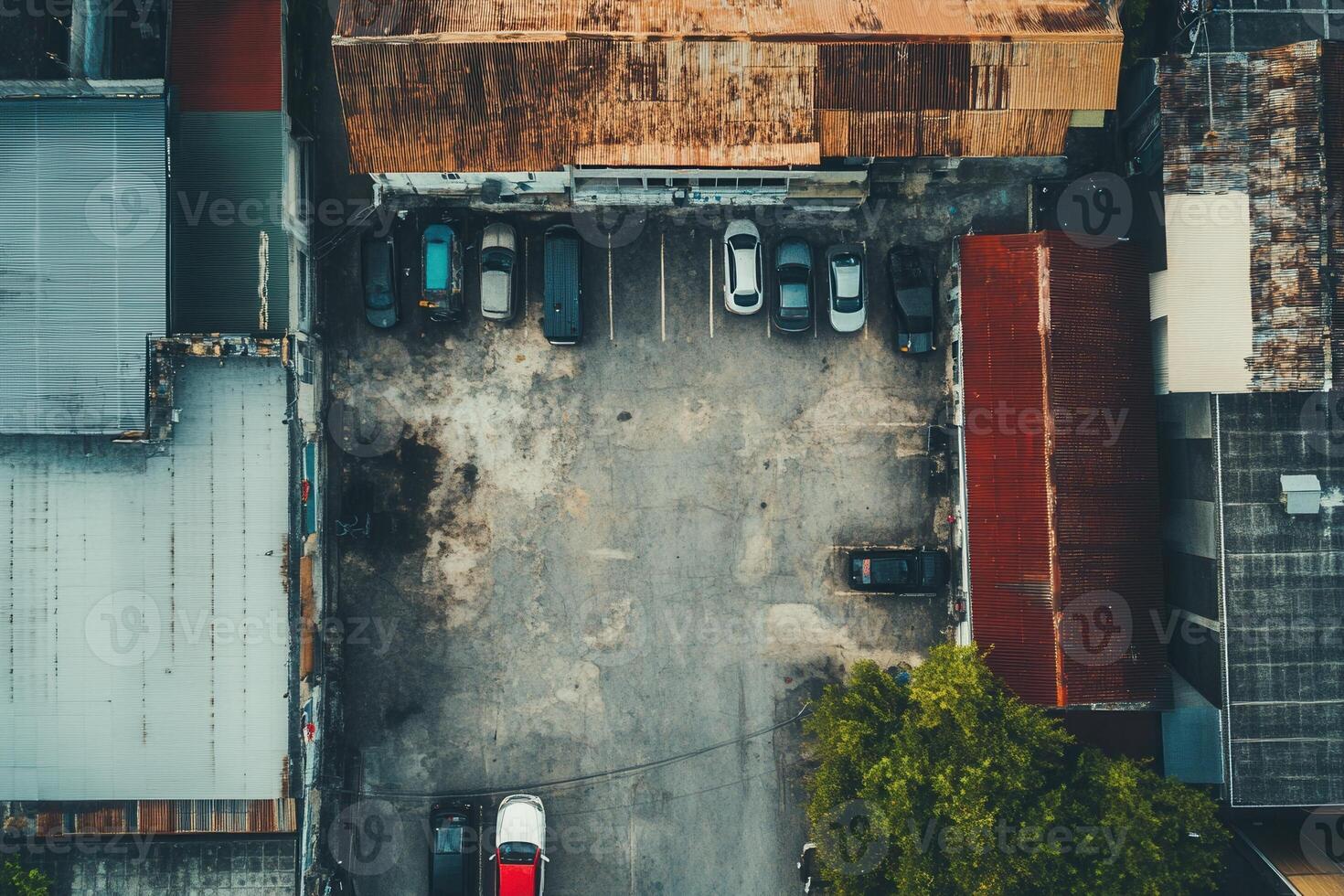 Aerial view of a city parking lot with cars and buildings. photo