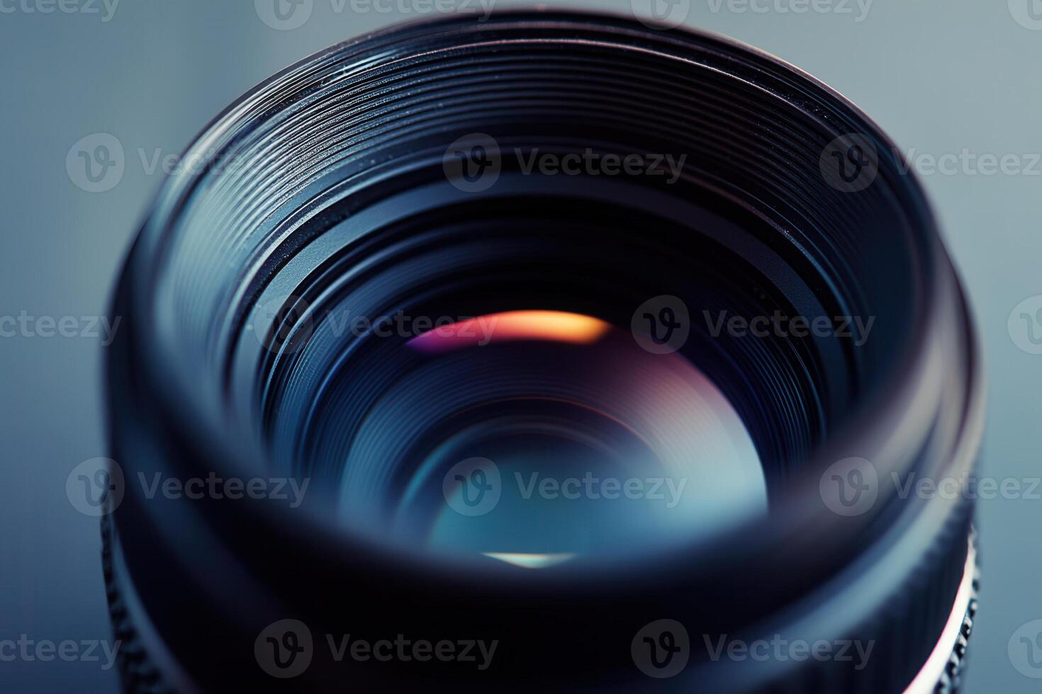 Close-up of a camera lens, showcasing its intricate details and reflective surface. photo