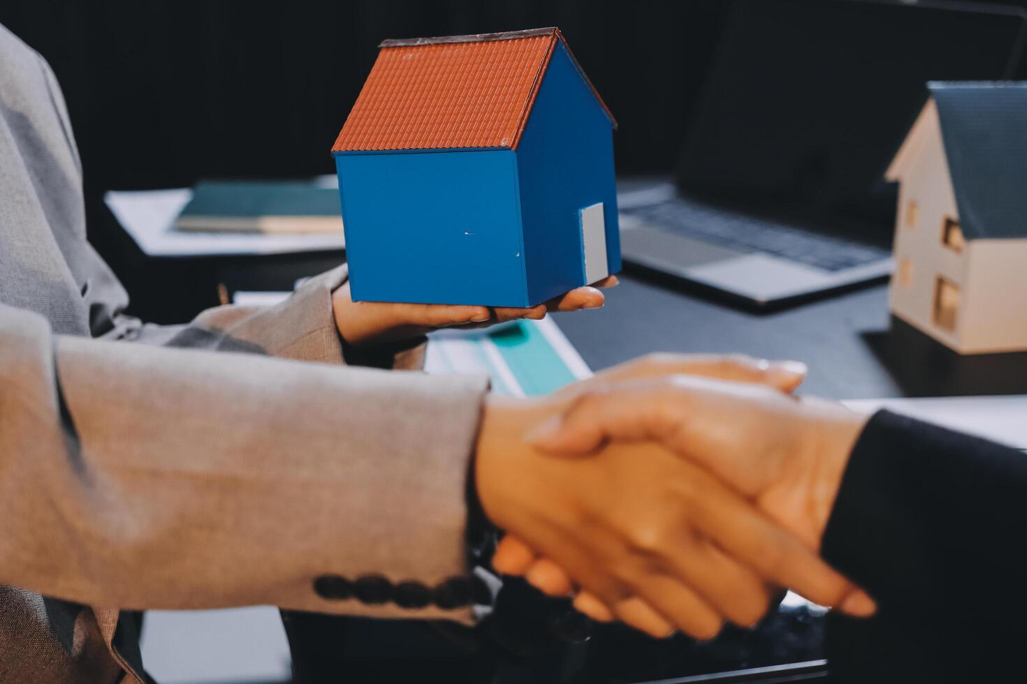Close up Business people or Real Estate agent explain signing agreement for sale house to client. Property, Insurance, Broker concept. photo