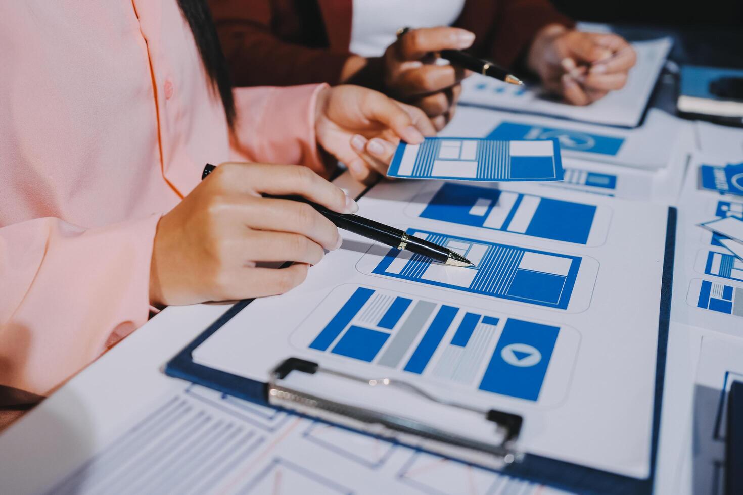 Young Asian business creative team work together, mobile application software design project. Brainstorm meeting, internet technology, smartphone web app designer, office coworker teamwork concept photo