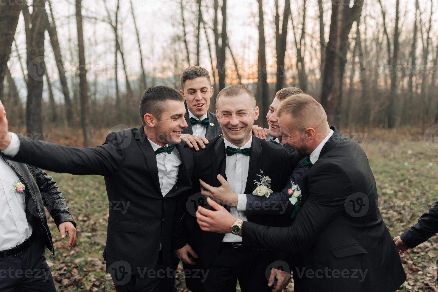 A group of men in suits are posing for a photo