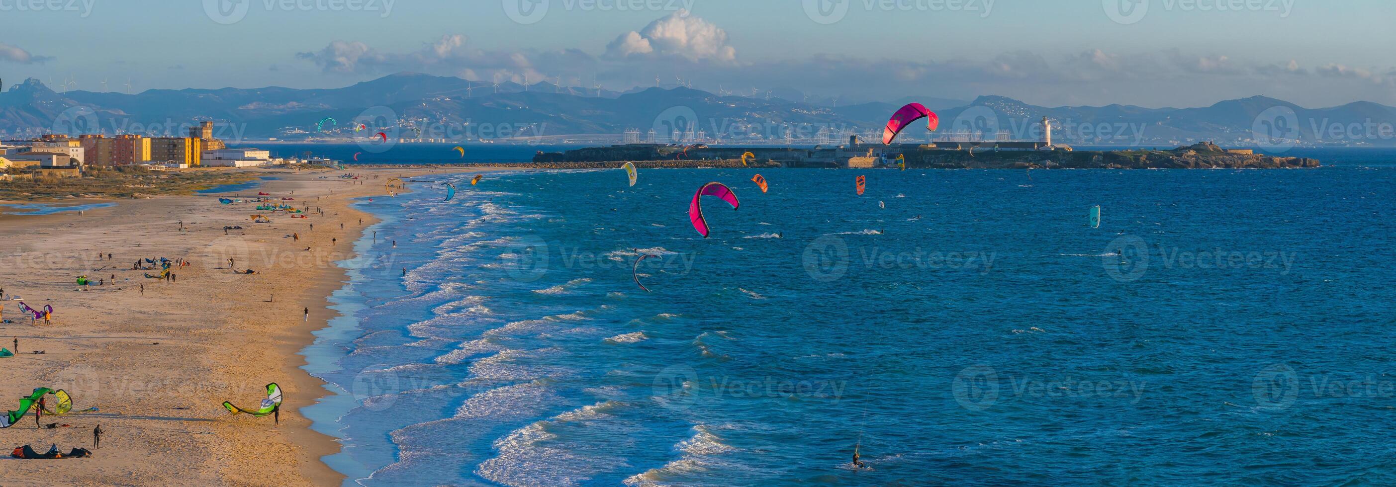 Aerial View of Tarifa's Coastline with Kite Surfers and Lighthouse photo