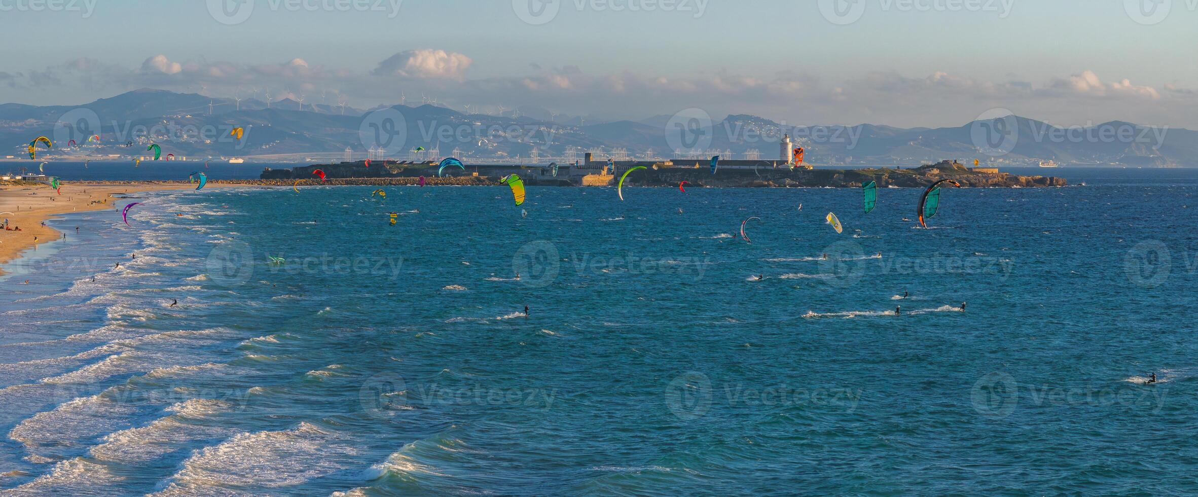 Aerial View of Tarifa's Coastline with Kite Surfers and Lighthouse photo