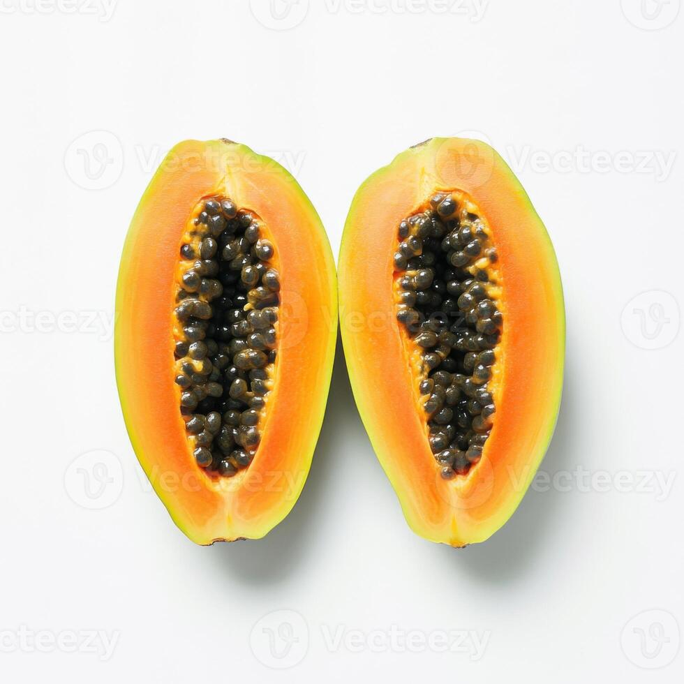 two half cut of ripe papaya with seeds isolated on white background photo