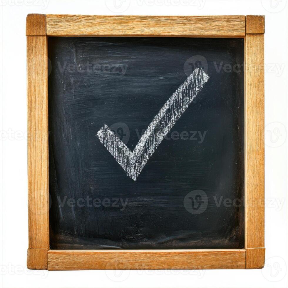 Check box with a tick drawn in chalk on a blackboard photo
