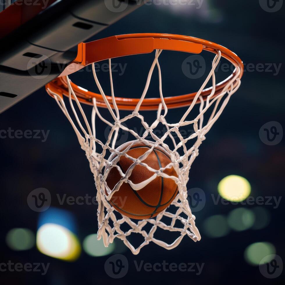 A basketball is in the net of a basketball hoop photo