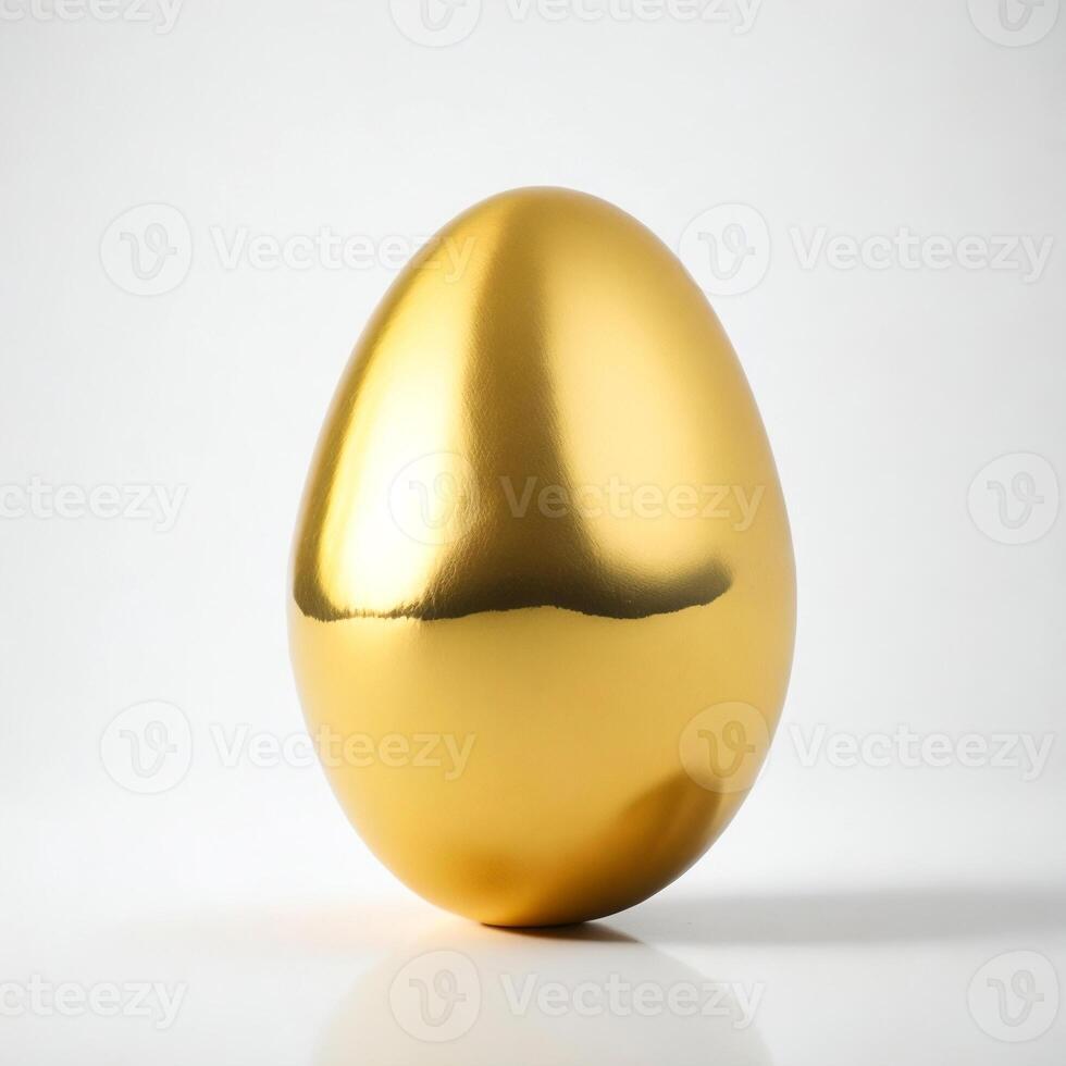 Golden egg on white background photo